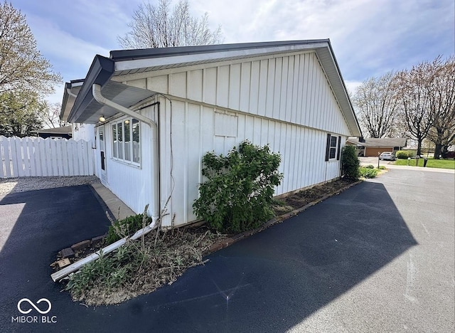 1406 Durham Dr, Crawfordsville, IN 47933 - view of home's exterior featuring board and batten siding and fence