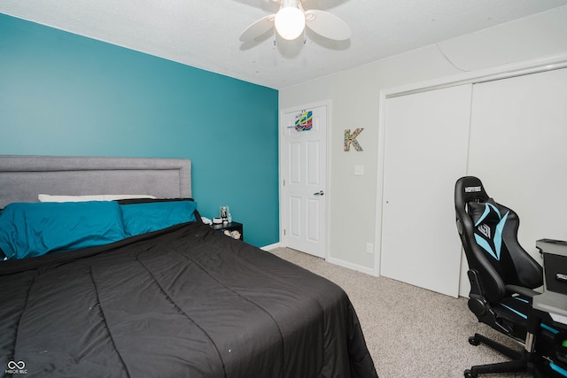 bedroom with carpet floors, baseboards, and a ceiling fan