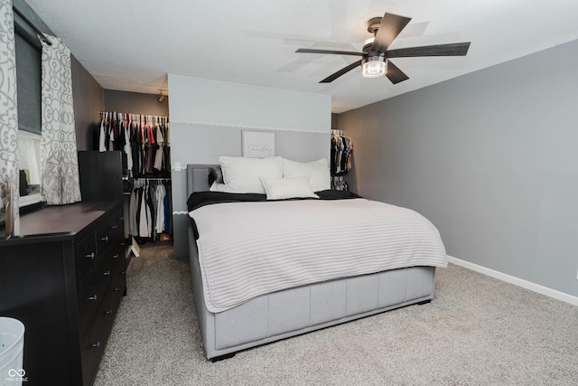 bedroom featuring ceiling fan, baseboards, and carpet flooring