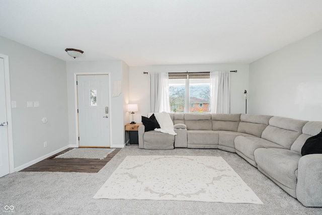 living room featuring baseboards and wood finished floors