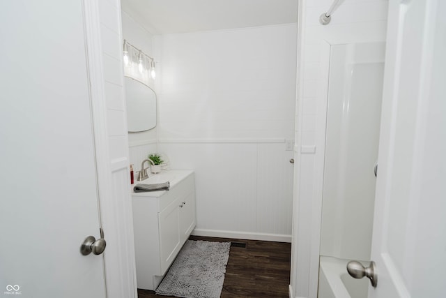 bathroom with wood finished floors and vanity