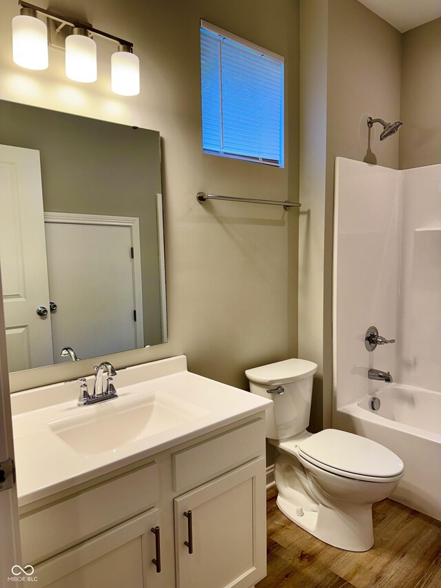 857 N Oakland Ave, Indianapolis, IN 46201 - full bathroom featuring wood finished floors, toilet, vanity, and shower / tub combination
