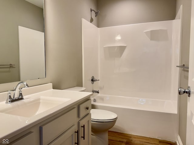 857 N Oakland Ave, Indianapolis, IN 46201 - full bath featuring wood finished floors, toilet, vanity, and shower / bathtub combination