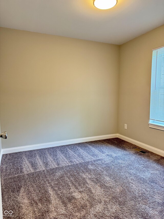 857 N Oakland Ave, Indianapolis, IN 46201 - carpeted empty room featuring baseboards