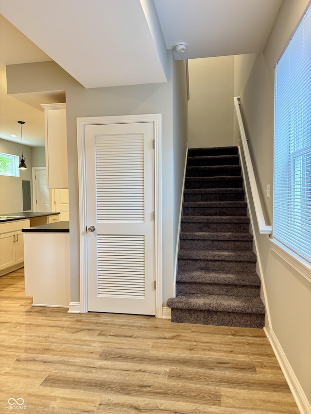 857 N Oakland Ave, Indianapolis, IN 46201 - stairway featuring wood finished floors and baseboards