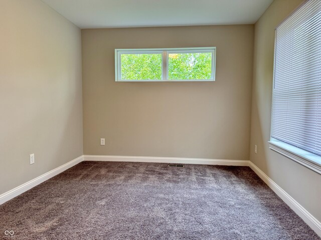 857 N Oakland Ave, Indianapolis, IN 46201 - spare room with dark colored carpet and baseboards