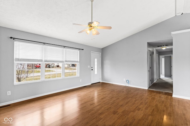 unfurnished living room featuring ceiling fan, wood finished floors, and visible vents