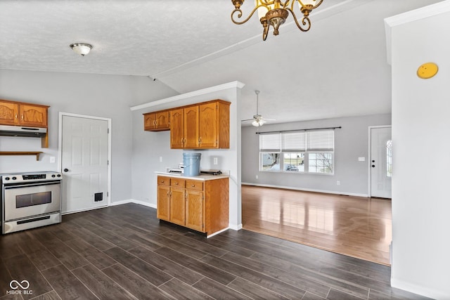 kitchen with electric stove, dark wood-type flooring, brown cabinetry, vaulted ceiling, and under cabinet range hood