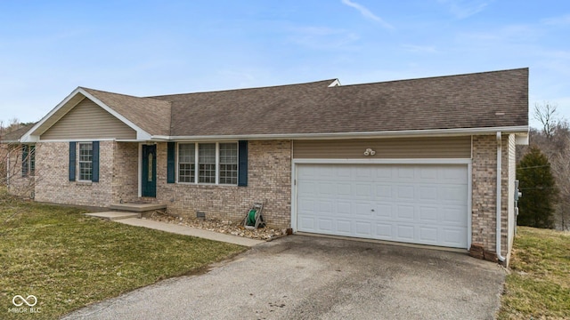 single story home featuring aphalt driveway, roof with shingles, brick siding, a garage, and a front lawn