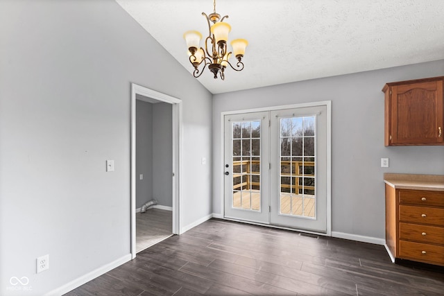 unfurnished dining area featuring lofted ceiling, dark wood-style floors, and baseboards