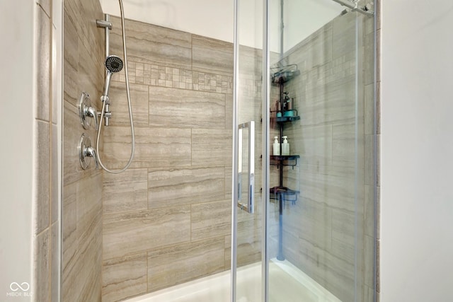 full bath featuring a shower stall