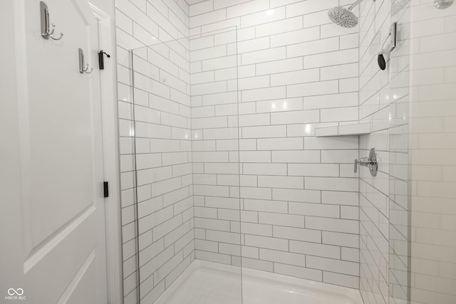 bathroom with a shower stall