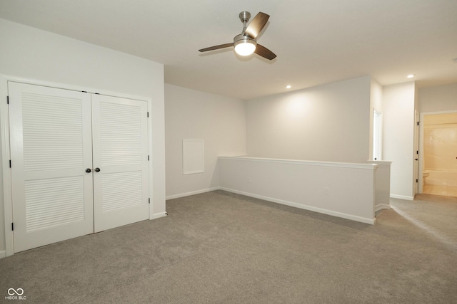 interior space featuring carpet floors, baseboards, a closet, and recessed lighting