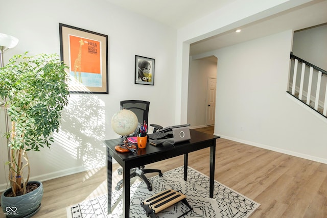 office featuring recessed lighting, light wood-style flooring, and baseboards