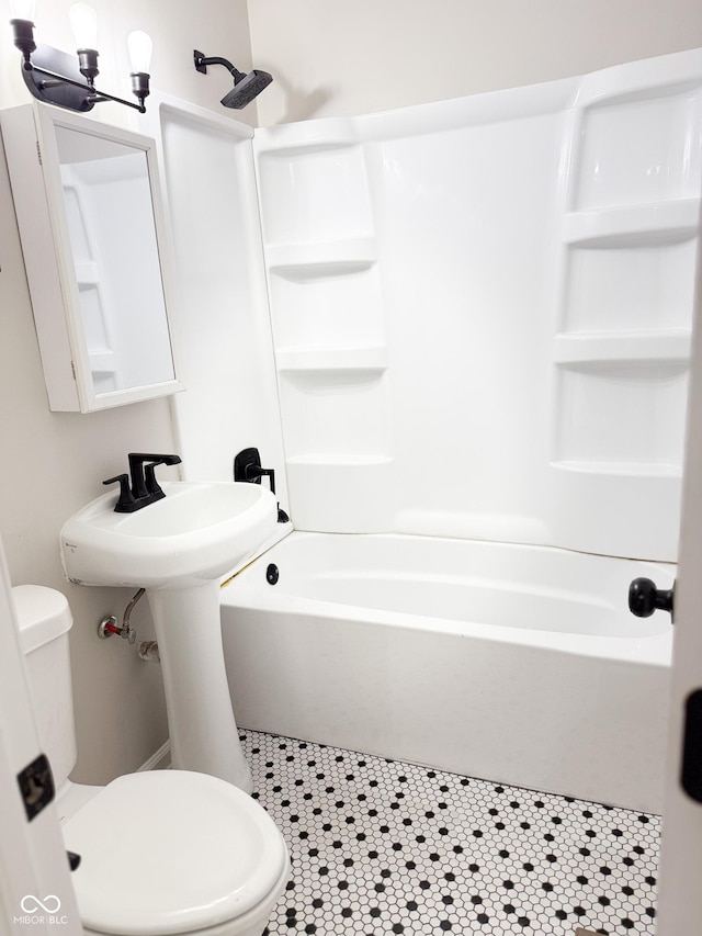 full bath with toilet, tile patterned floors, and shower / bathing tub combination