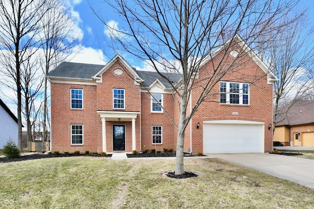 view of front of property with brick siding, driveway, an attached garage, and a front yard