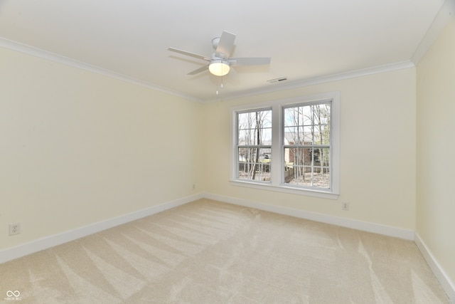 unfurnished room with visible vents, light carpet, a ceiling fan, crown molding, and baseboards