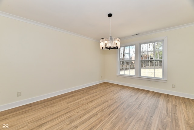 unfurnished dining area with visible vents, a notable chandelier, ornamental molding, light wood-style floors, and baseboards