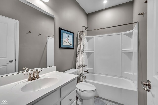 full bath with tile patterned flooring, shower / bath combo, vanity, and toilet