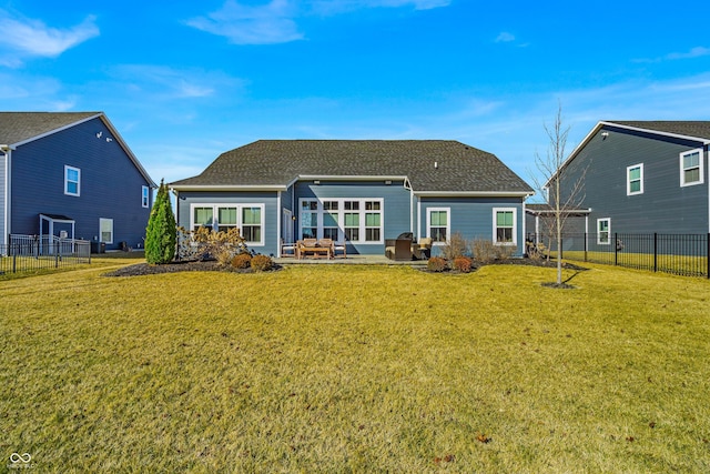 back of house with a lawn, a patio area, and a fenced backyard