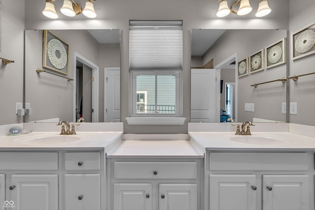 bathroom with a sink and double vanity