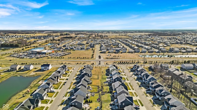 birds eye view of property with a residential view and a water view