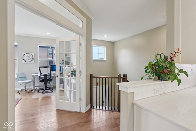 hall with recessed lighting, baseboards, and wood finished floors