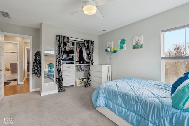 bedroom with a ceiling fan, carpet, and visible vents