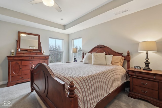 bedroom featuring visible vents, baseboards, ceiling fan, and carpet floors