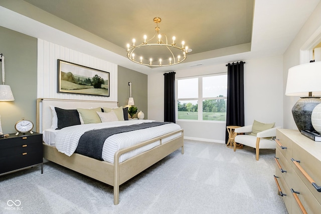 bedroom featuring light carpet, baseboards, a raised ceiling, and a notable chandelier