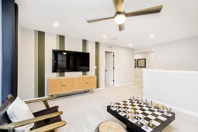 sitting room with recessed lighting, light colored carpet, visible vents, baseboards, and wallpapered walls