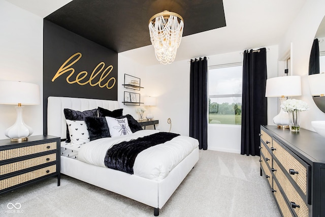 bedroom with light colored carpet and a notable chandelier