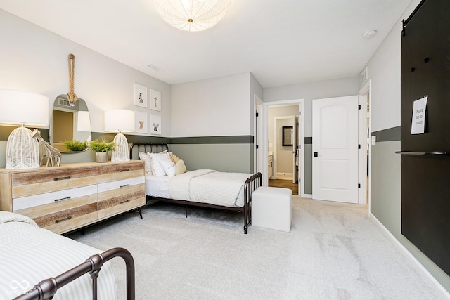 bedroom with light colored carpet, visible vents, and baseboards