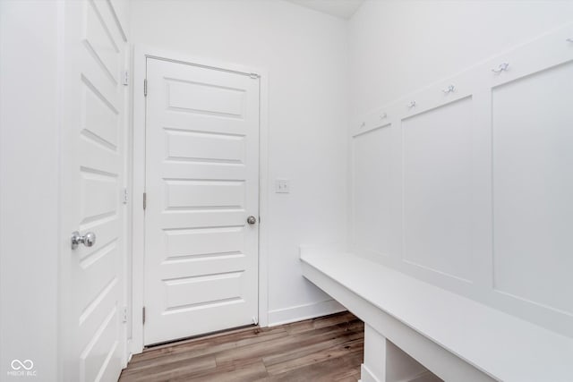 mudroom featuring baseboards and wood finished floors