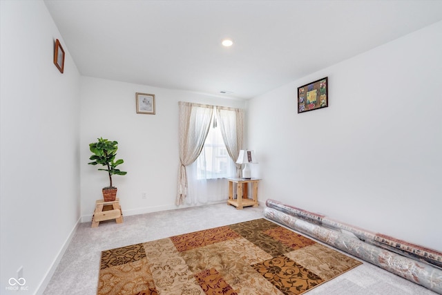 interior space with baseboards and carpet floors