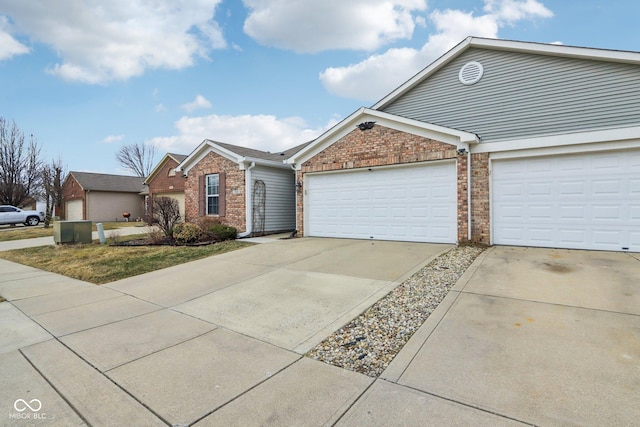 ranch-style house with brick siding, driveway, and an attached garage