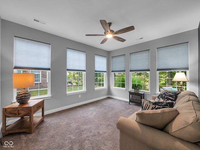 sunroom with visible vents and ceiling fan