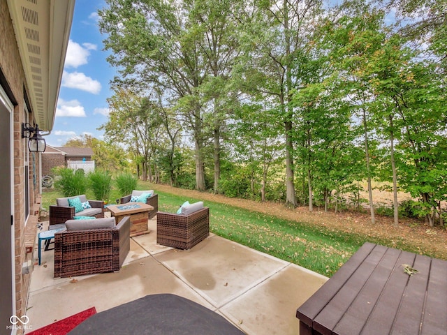 view of patio / terrace with an outdoor living space with a fire pit