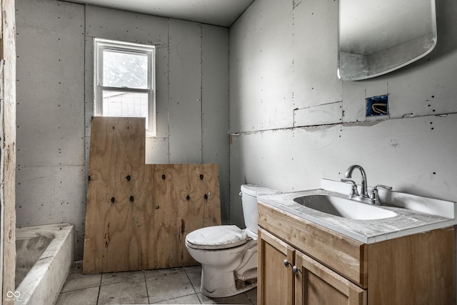 full bath featuring vanity and toilet