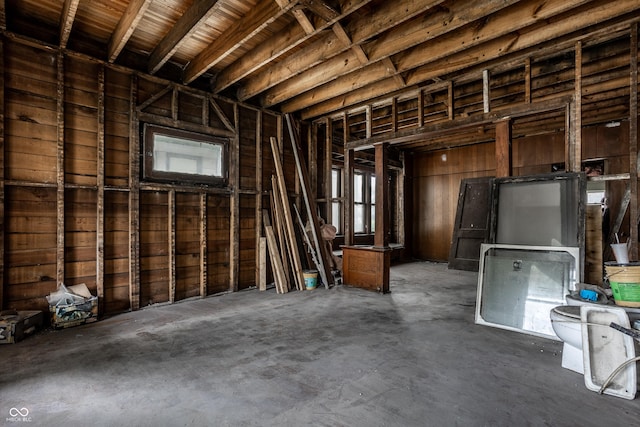 misc room with unfinished concrete floors