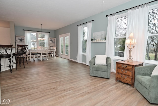 interior space with light wood-type flooring and baseboards