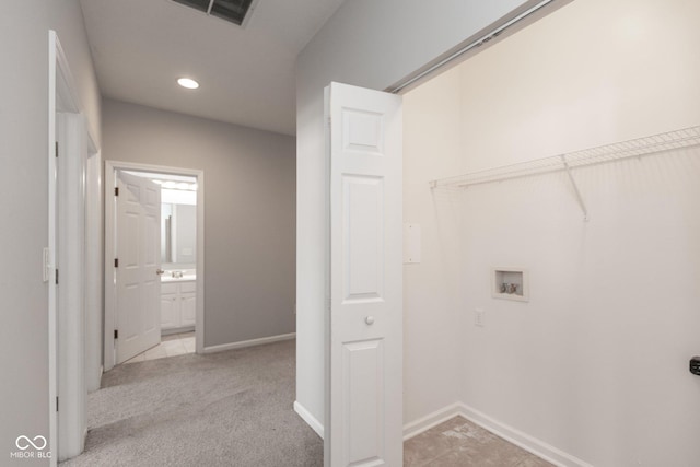 laundry area featuring hookup for a washing machine, light carpet, laundry area, visible vents, and baseboards