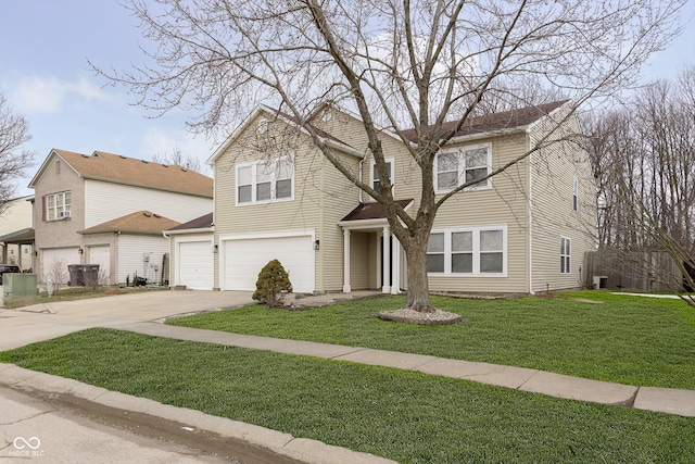 view of front facade featuring a garage, a front lawn, and concrete driveway