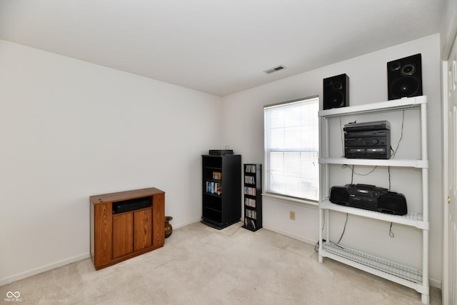 office area with carpet, visible vents, and baseboards