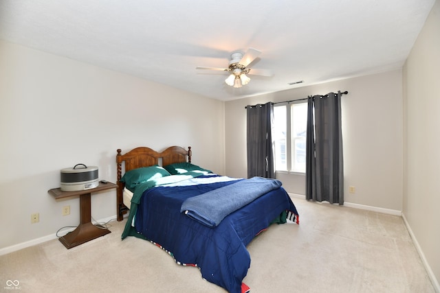 bedroom with baseboards, visible vents, carpet floors, and ceiling fan