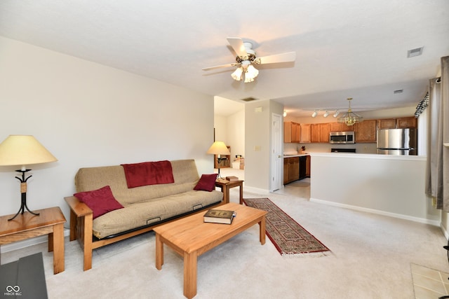 living room with baseboards, visible vents, ceiling fan, track lighting, and light colored carpet