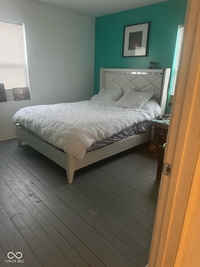 bedroom with hardwood / wood-style floors