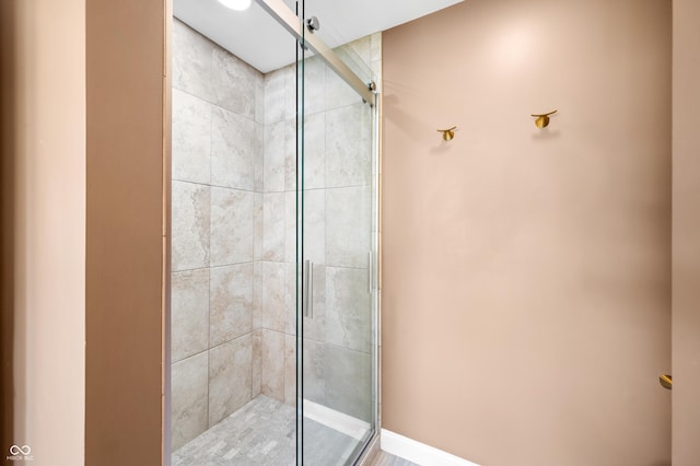 bathroom with a shower stall