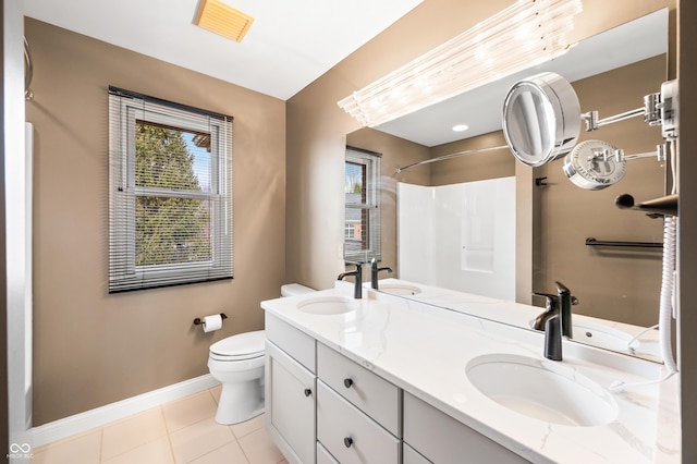 full bathroom featuring tile patterned flooring, baseboards, a sink, and toilet