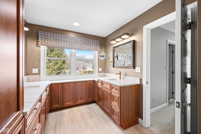 full bathroom featuring vanity and baseboards